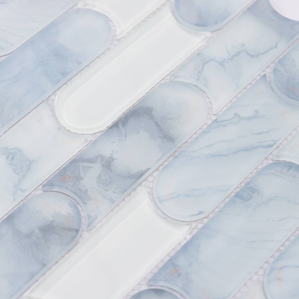 Blue white capsule shaped glass mosaic tile surface with soft marble-like patterns