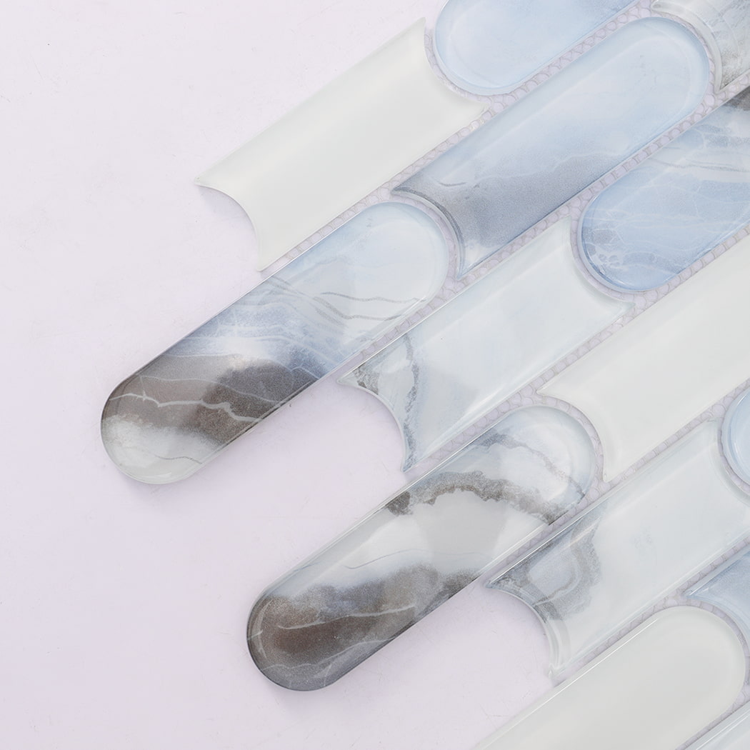 Close up of blue white interlocking capsule glass mosaic tile pieces