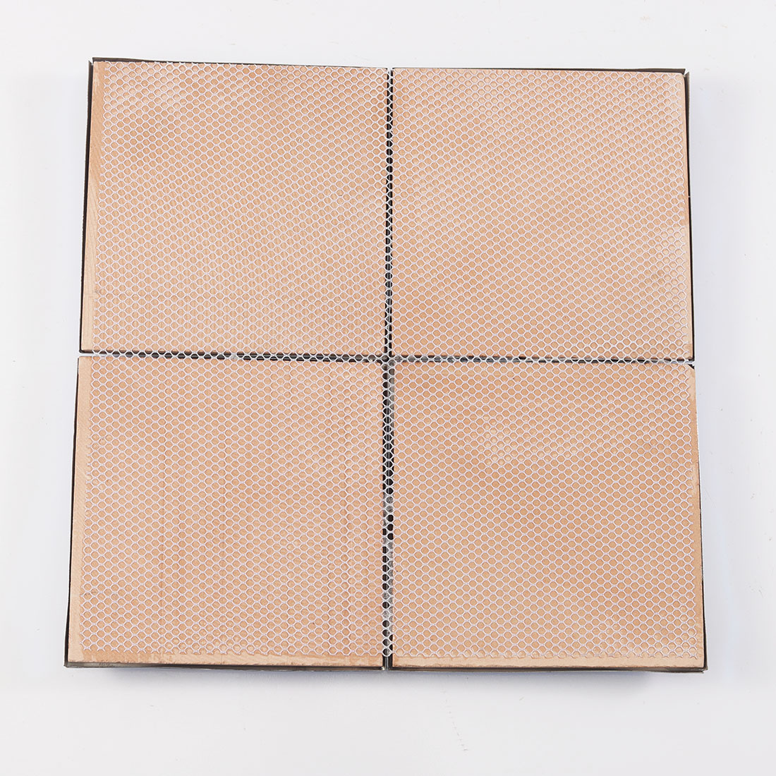 Back view of blue metal mosaic tile with mesh backing for installation