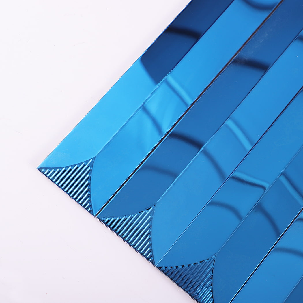 Close-up of corner showing blue metal wall tile texture and reflection