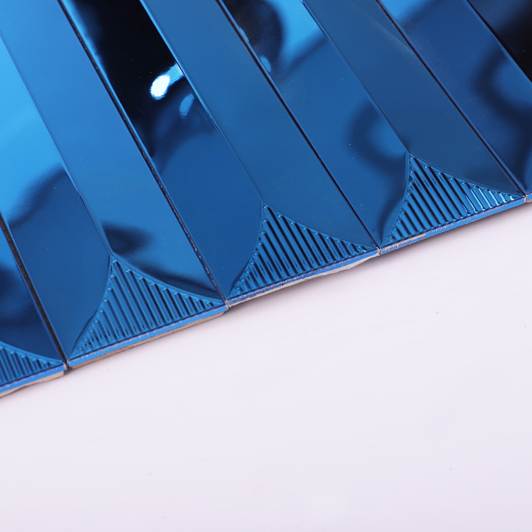 Edge close-up showing glossy surface of blue stainless steel wall tile