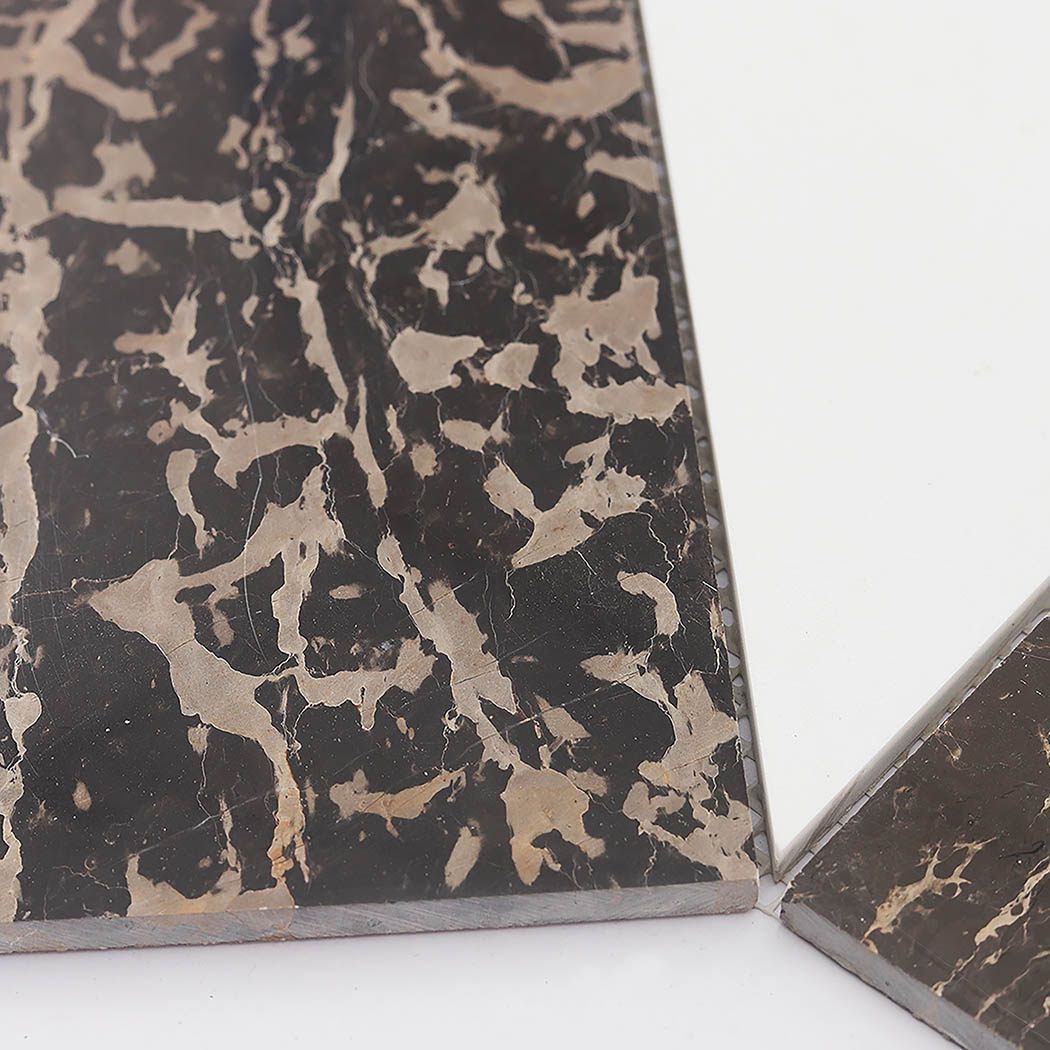Brown marble geometric mosaic tile detail with contrasting white marble pieces