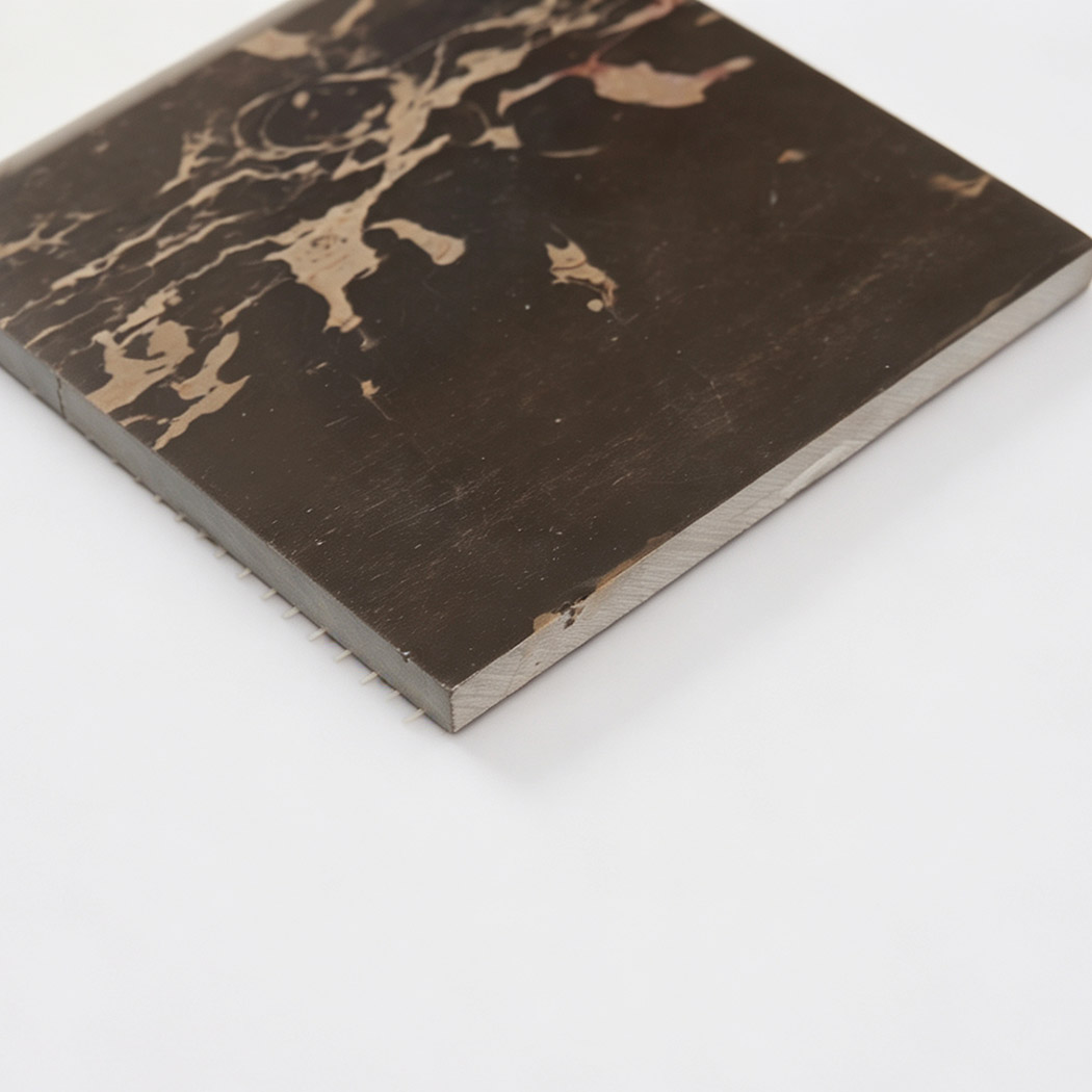 Side view of brown marble square mosaic tile with natural beige veining