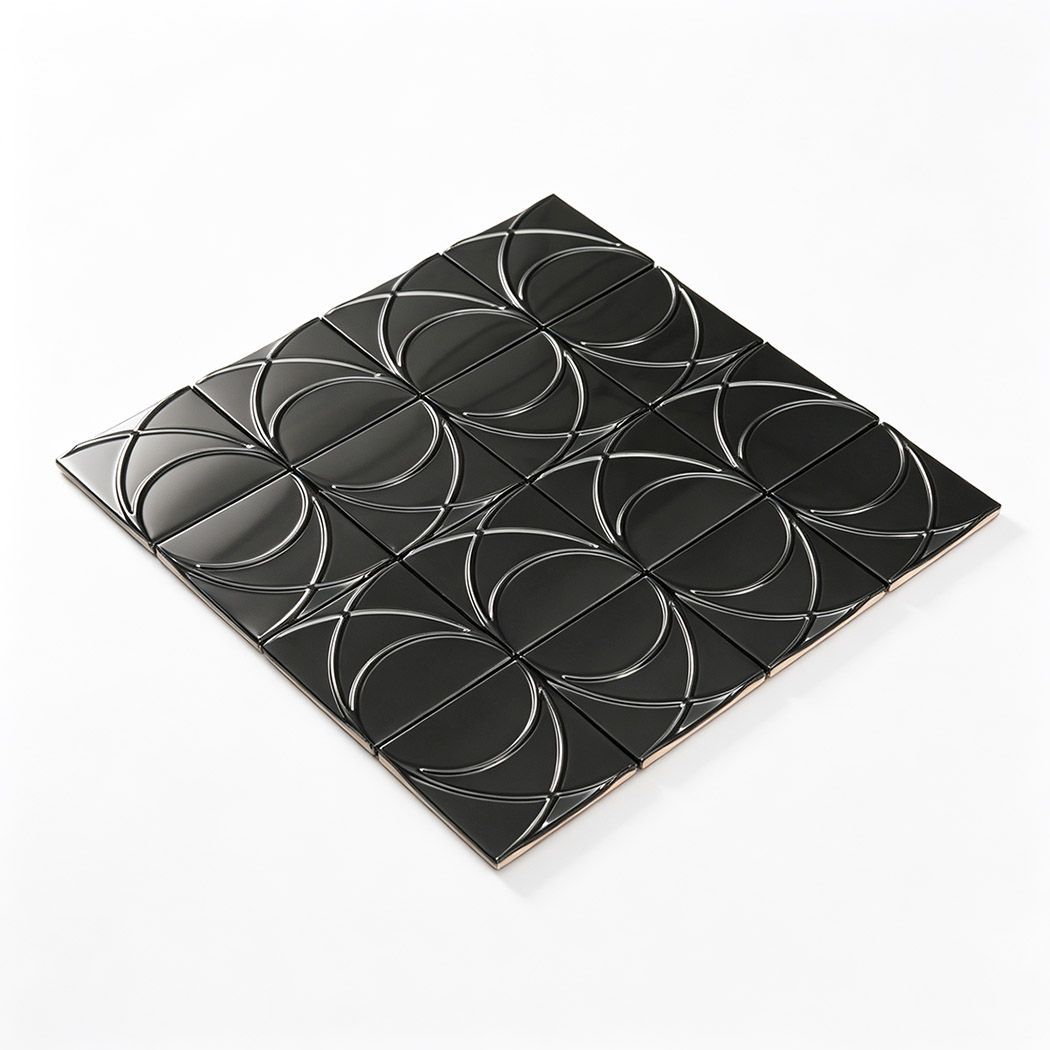 Angled view of brushed black stainless steel square mosaic tile
