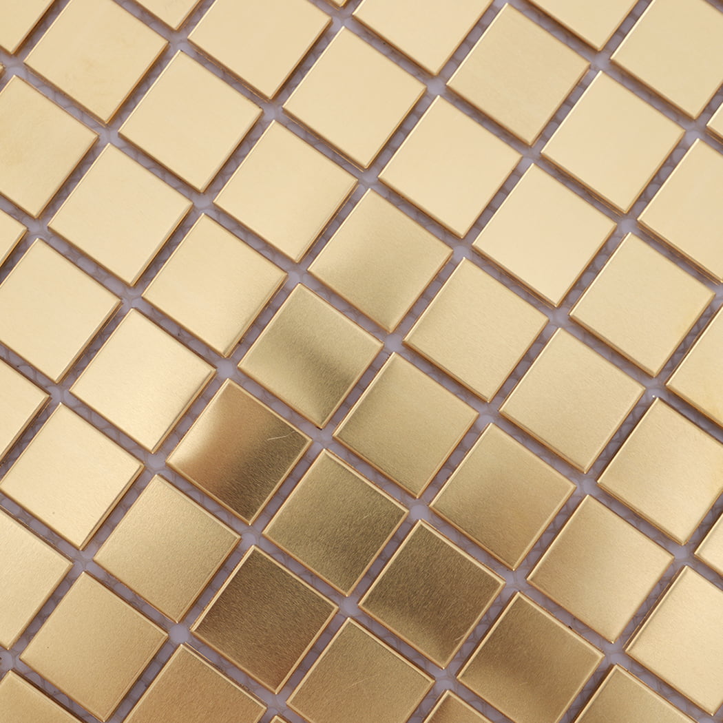 Close-up highlighting brushed finish and metallic shine of brass mosaic tile.