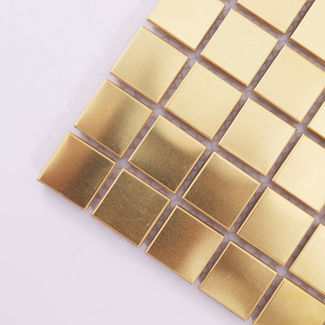 Corner close-up showing brushed texture of brass square mosaic metal tile.