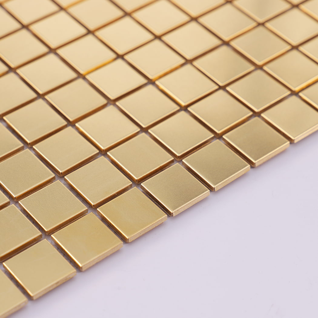 Edge detail of brushed brass square mosaic metal tile.
