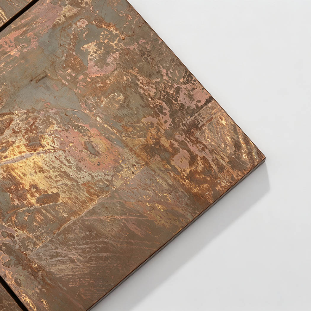Close-up of brushed copper mosaic tile with layered bronze and rose gold textures