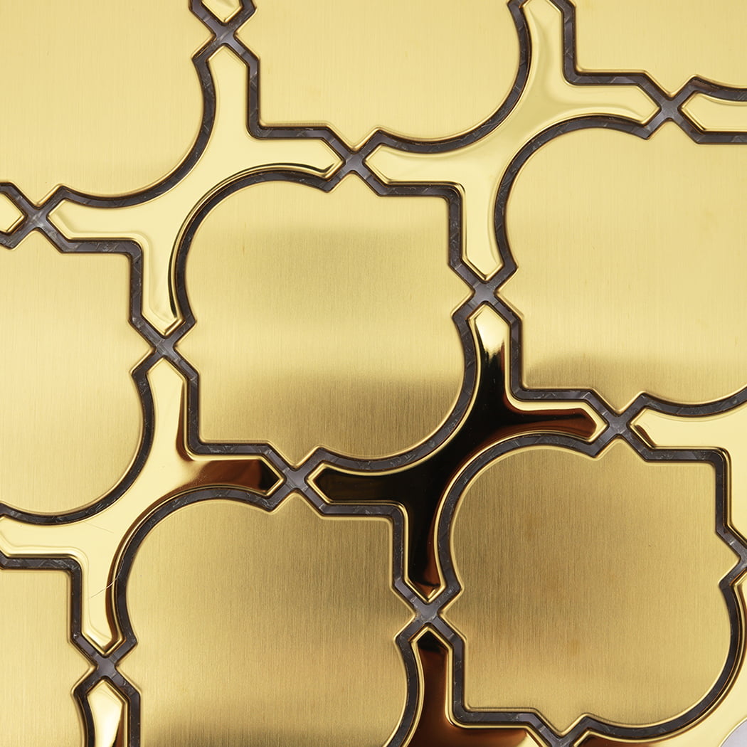Detailed texture of brushed gold metal lantern-shaped mosaic tiles.