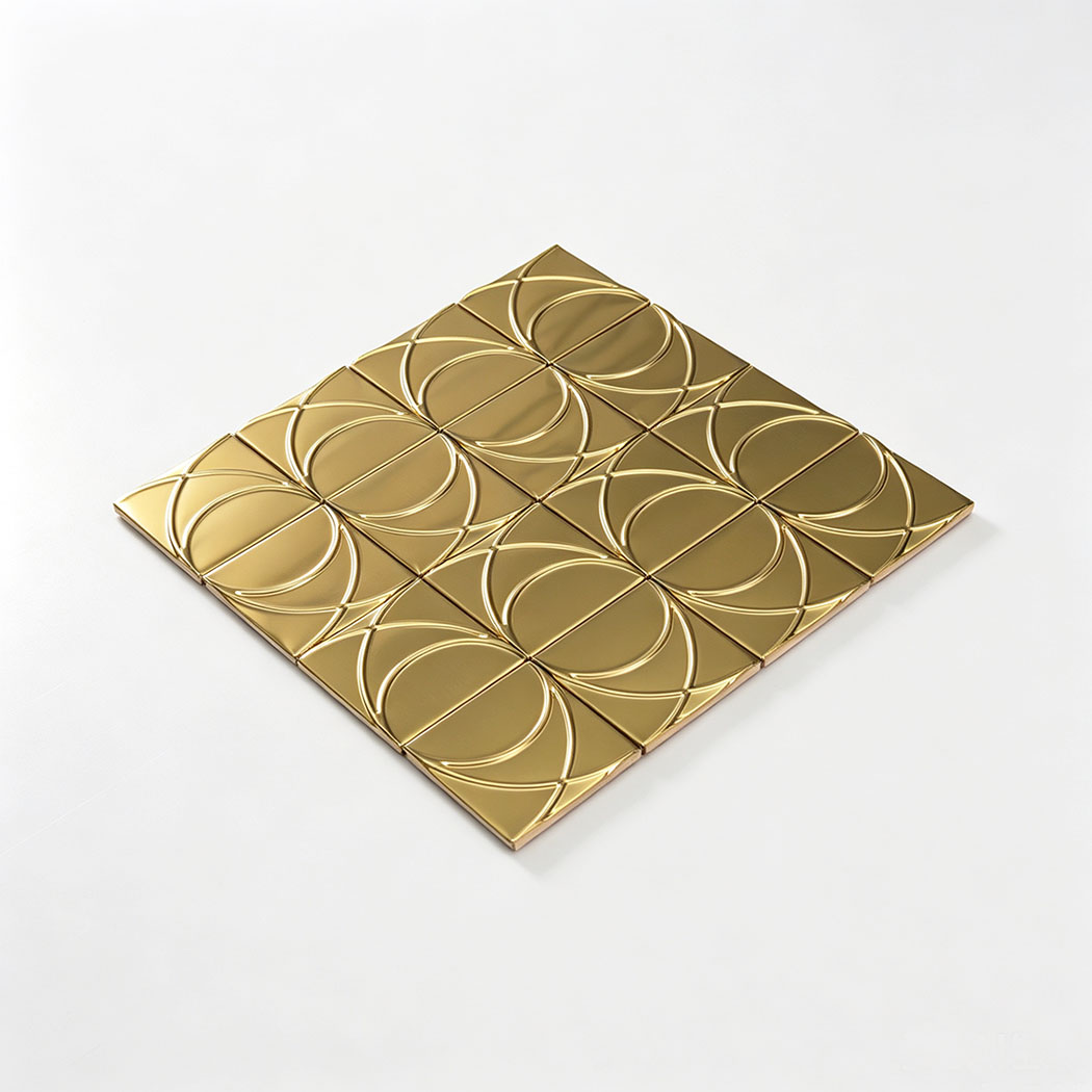 Angled view of brushed gold stainless steel square pattern mosaic tile