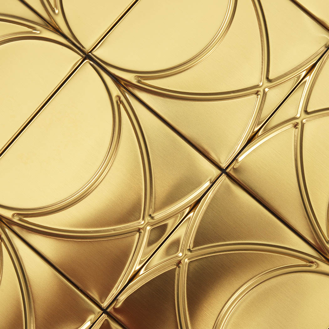 Close-up of brushed gold stainless steel square pattern mosaic surface