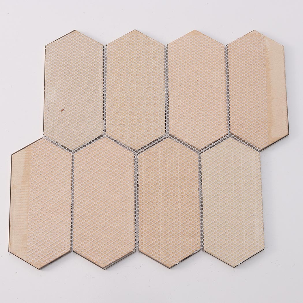 Back view of gold hexagon mosaic tile sheet showing mesh mounted installation base