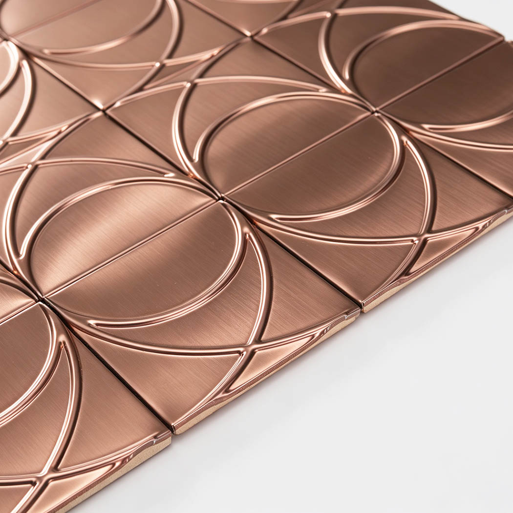 Edge detail of brushed rose gold stainless steel square pattern mosaic tile