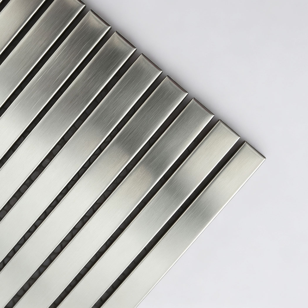 Corner close-up of brushed silver stainless steel ribbon tile