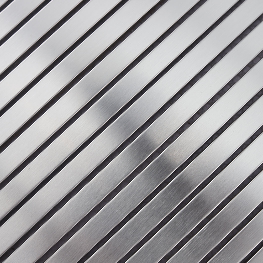 Close-up of brushed silver stainless steel ribbon tile strips