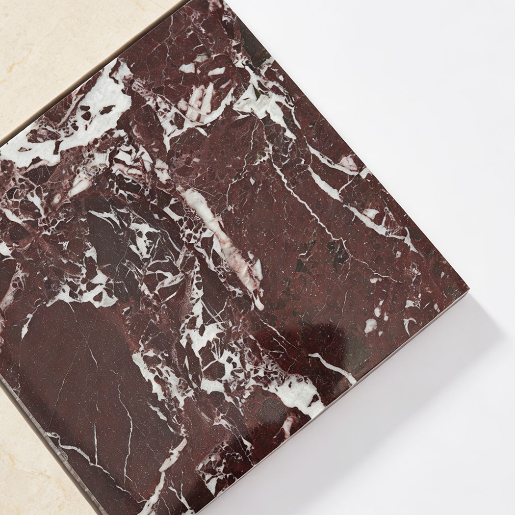 Burgundy marble detail in cream and burgundy checkered mosaic tile