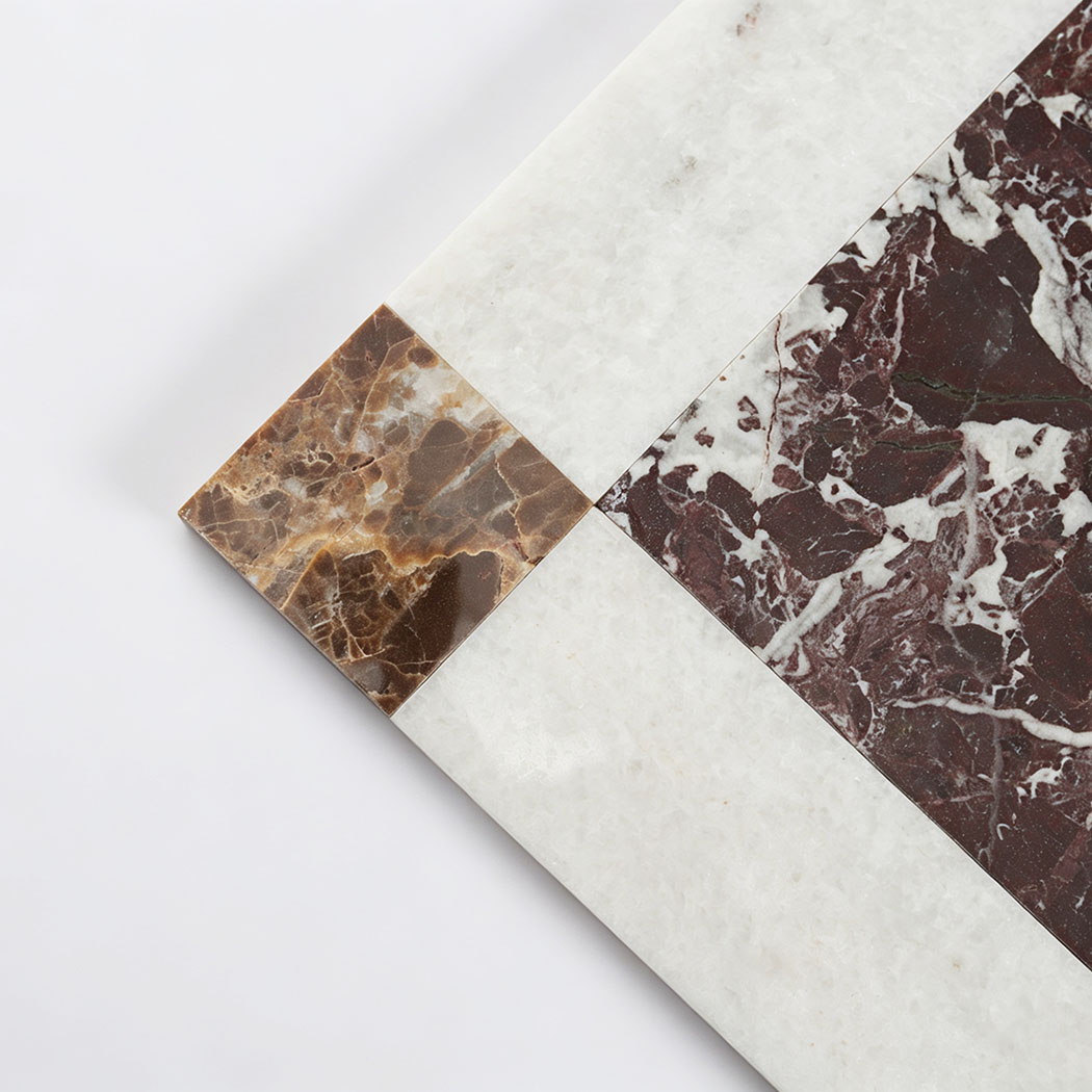 Burgundy marble center and white border detail of square mosaic tile