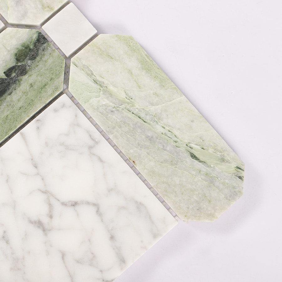 Corner close-up of Carrara white and green geometric marble mosaic tile