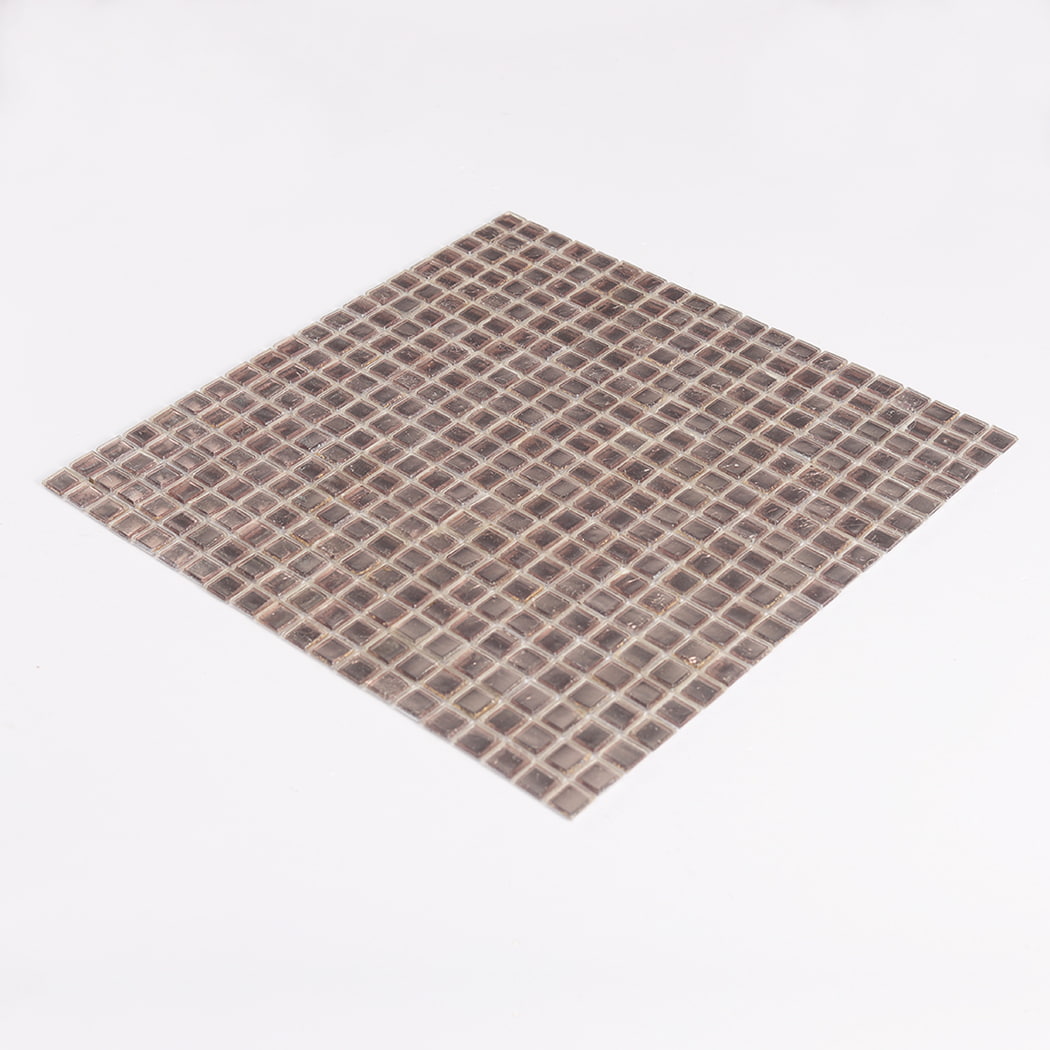 Angled view of champagne silver foil glass square mosaic tile sheet highlighting shine