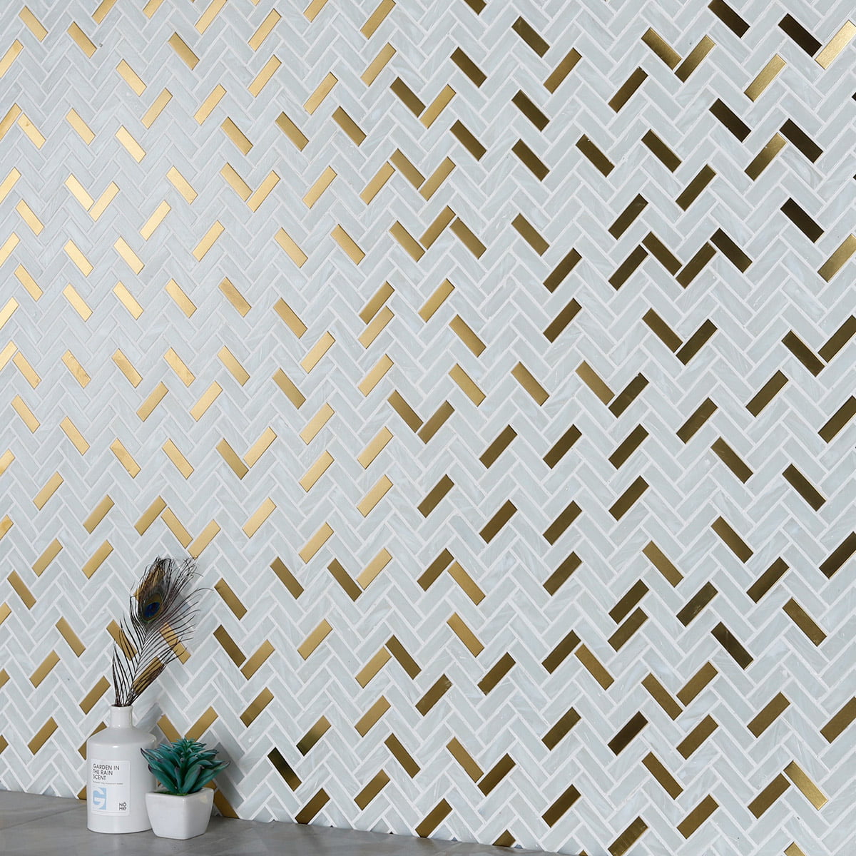 Chic white herringbone mosaic with gold highlights in modern interior