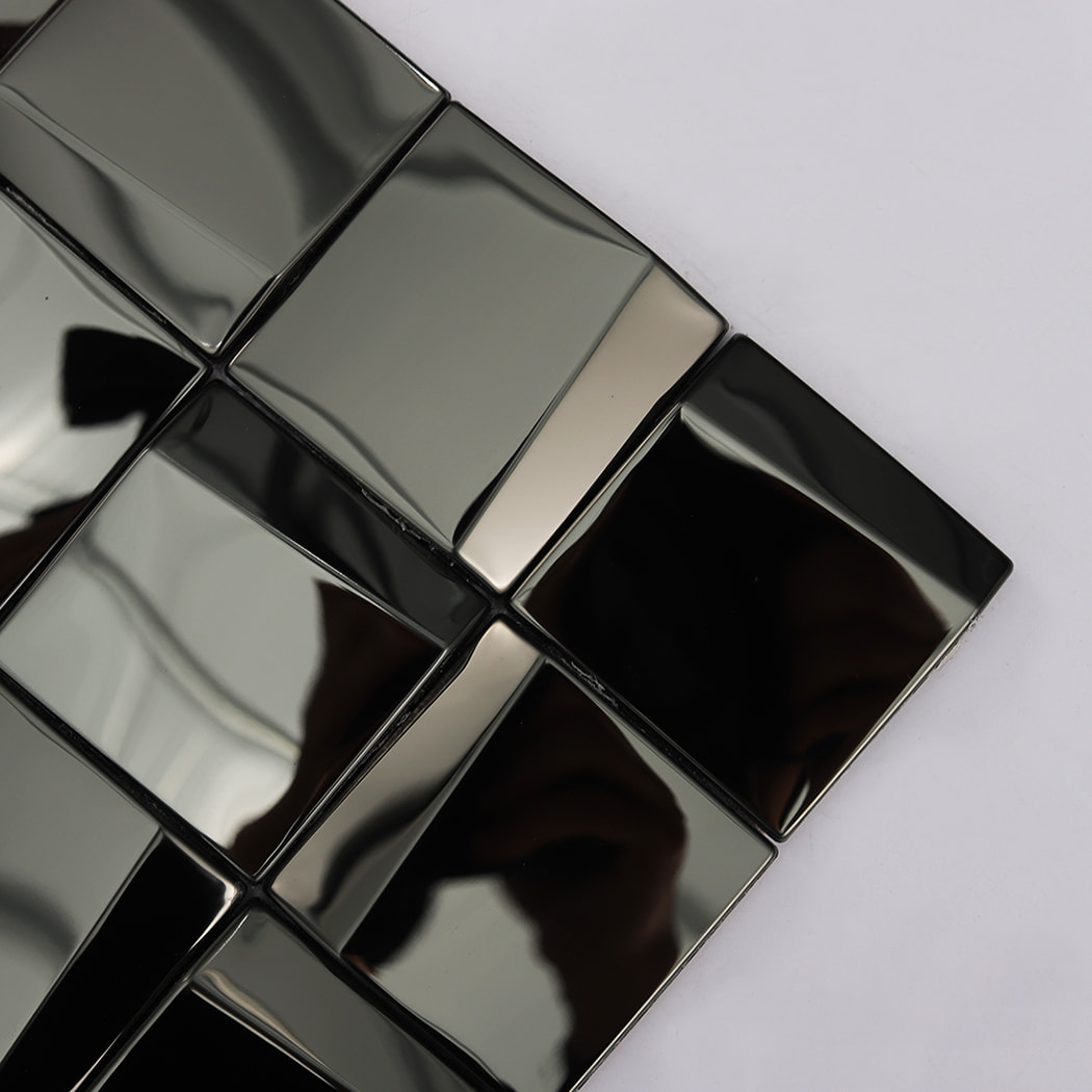 Detailed close up of the corner of a black reflective square mosaic tile sheet.