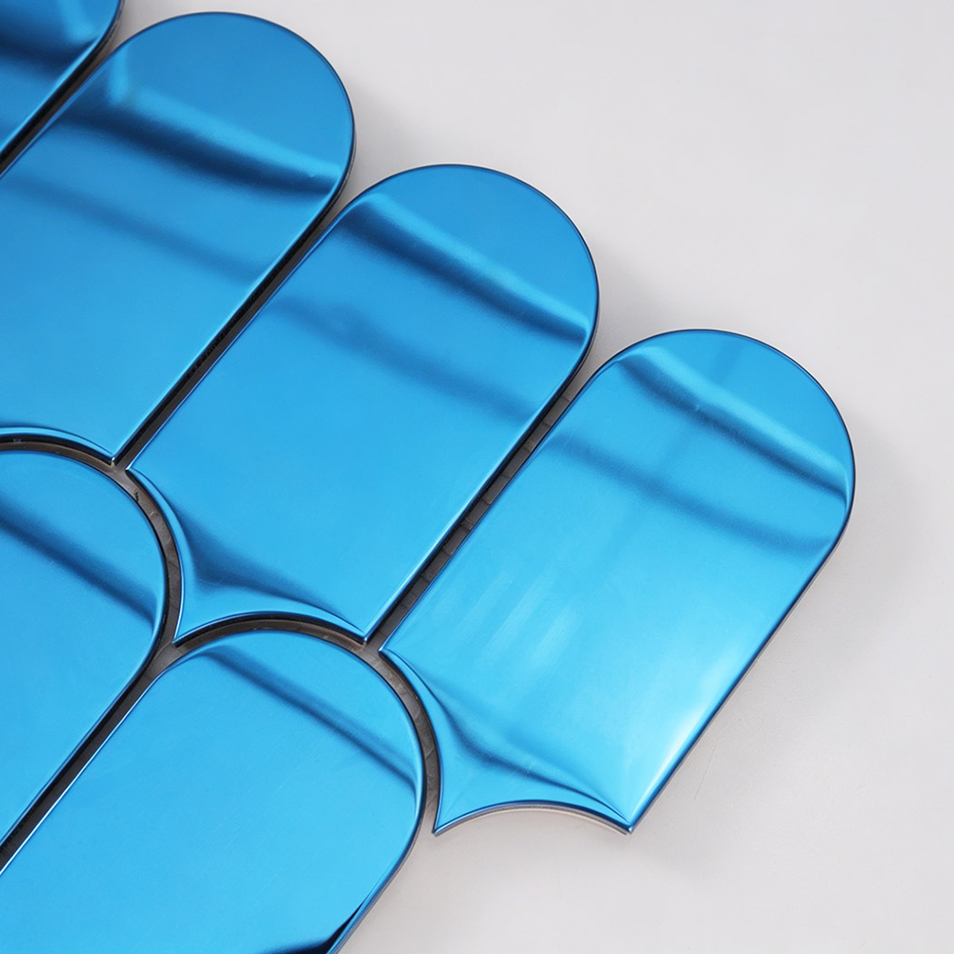Close up of blue arch metal mosaic tile edge with rounded shape and reflection