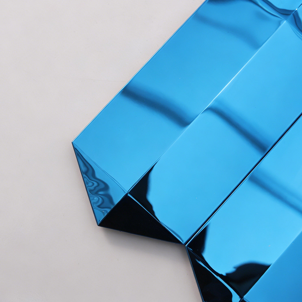 Close up of blue mirror picket mosaic tile edge with reflective beveled ends