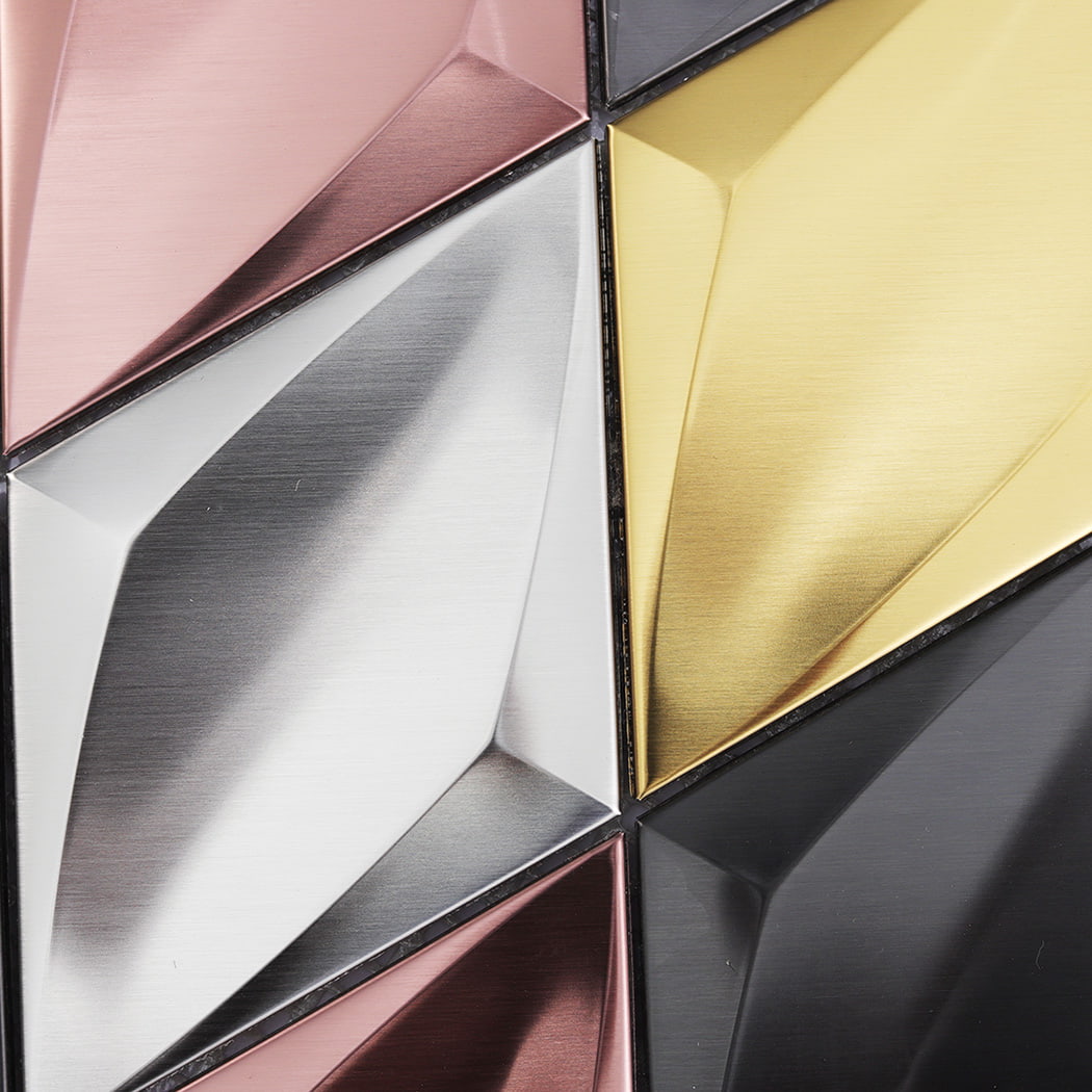 Close-up of a 3D silver diamond metal tile showing the brushed texture and facets.