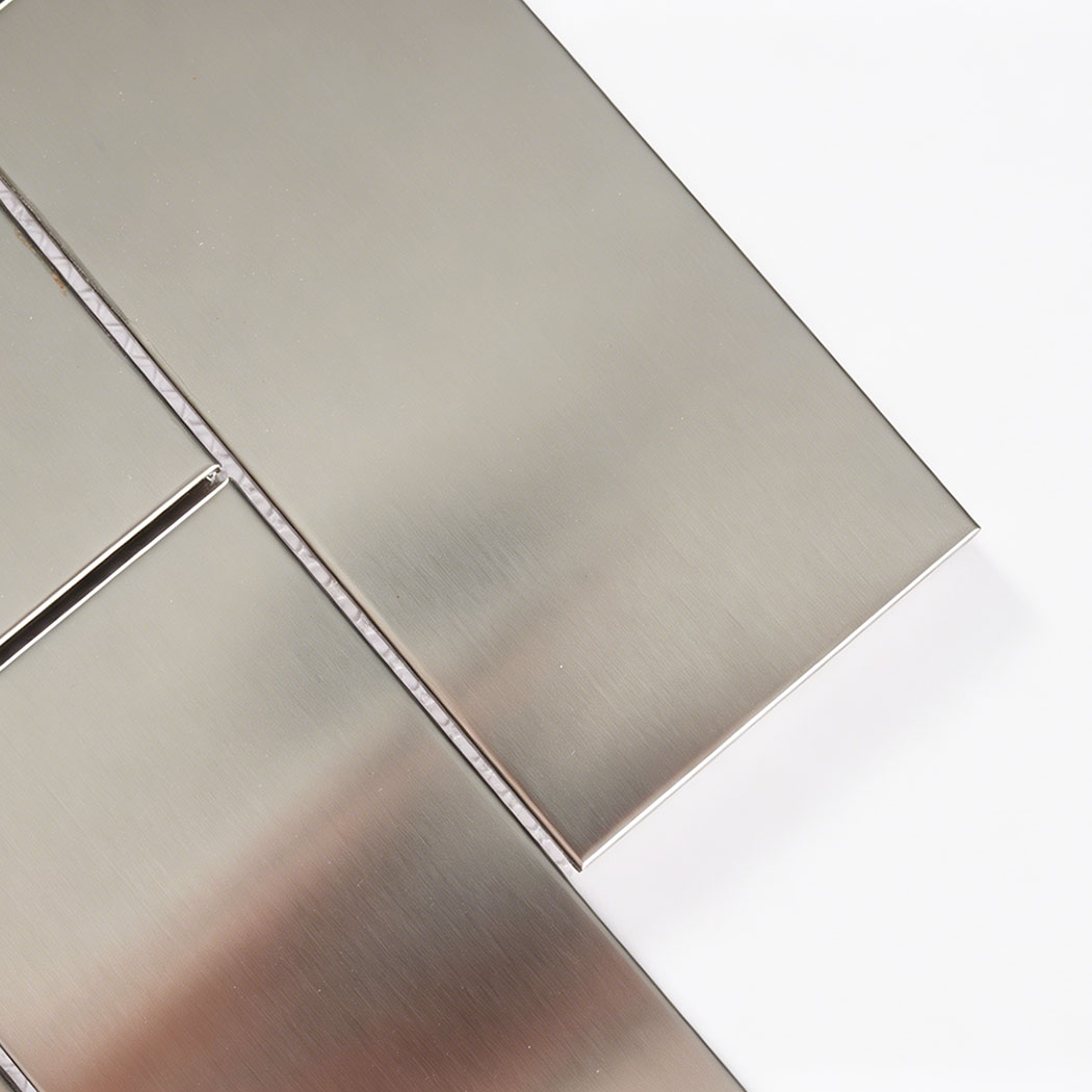 Close up of brushed stainless steel subway tile with smooth metallic surface
