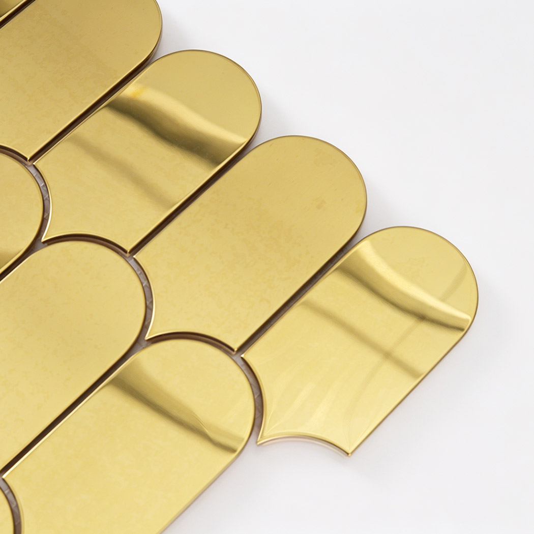 Close up of gold arch metal mosaic tile edge with curved top and glossy reflection
