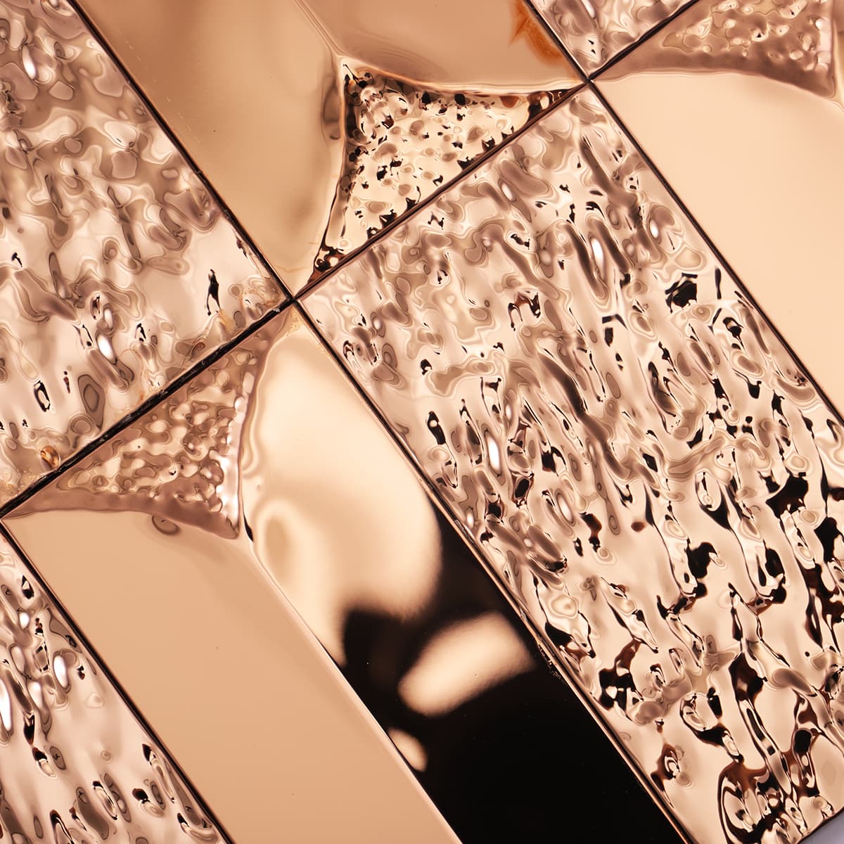 Rose gold 3D hammered stainless steel tile corner close-up
