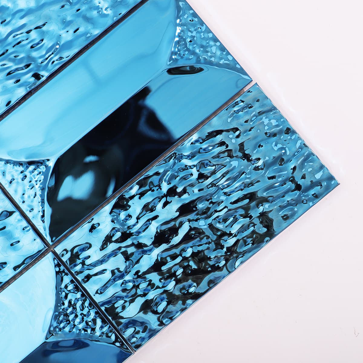 Close-up highlighting the glossy blue mirror finish and modern rectangular shape