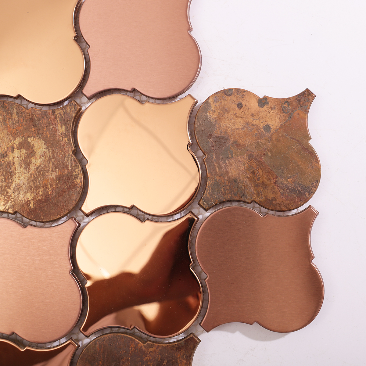 Close-up highlighting the intricate arabesque pattern and mixed metallic tones.