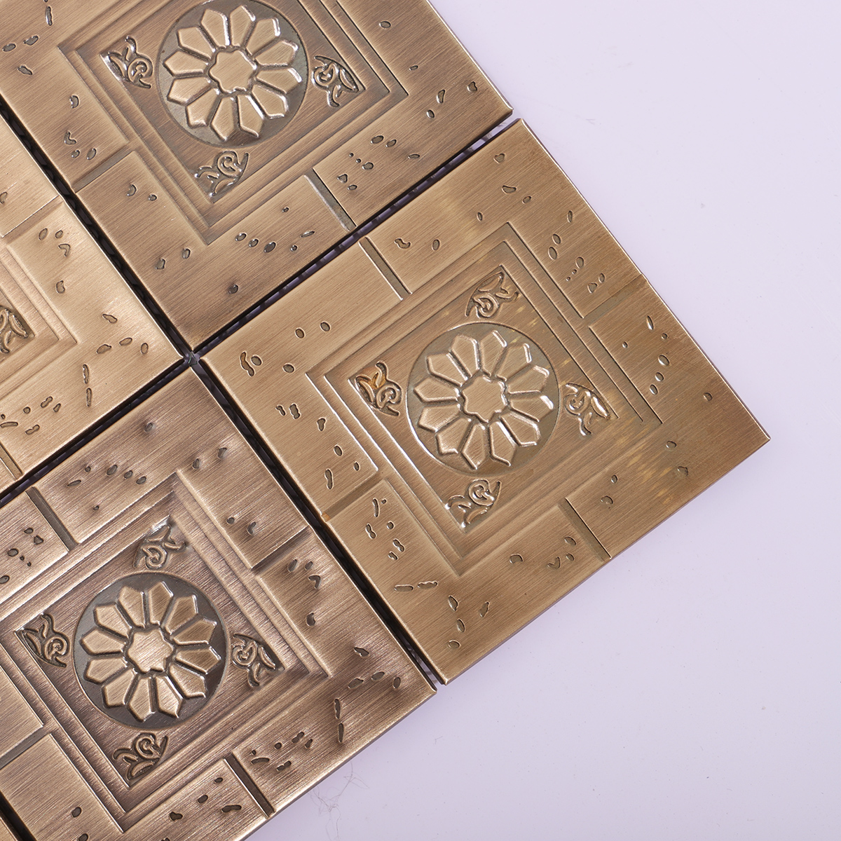 Close-up showcasing the intricate floral patterns and aged brass finish