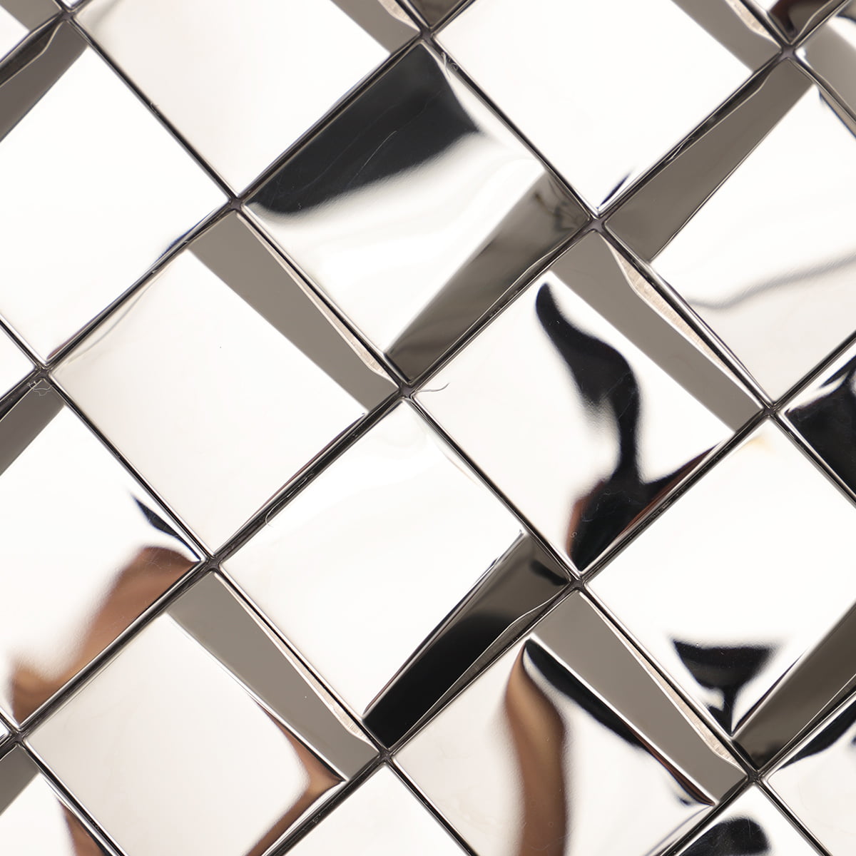 Close-up of glossy silver square tiles with reflective surfaces