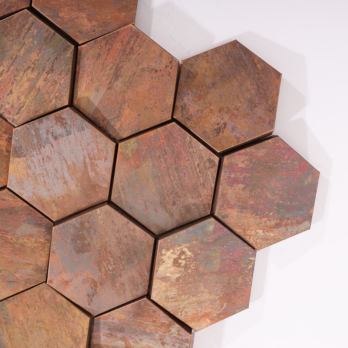 Close-up of the aged copper finish and beveled hexagon texture.