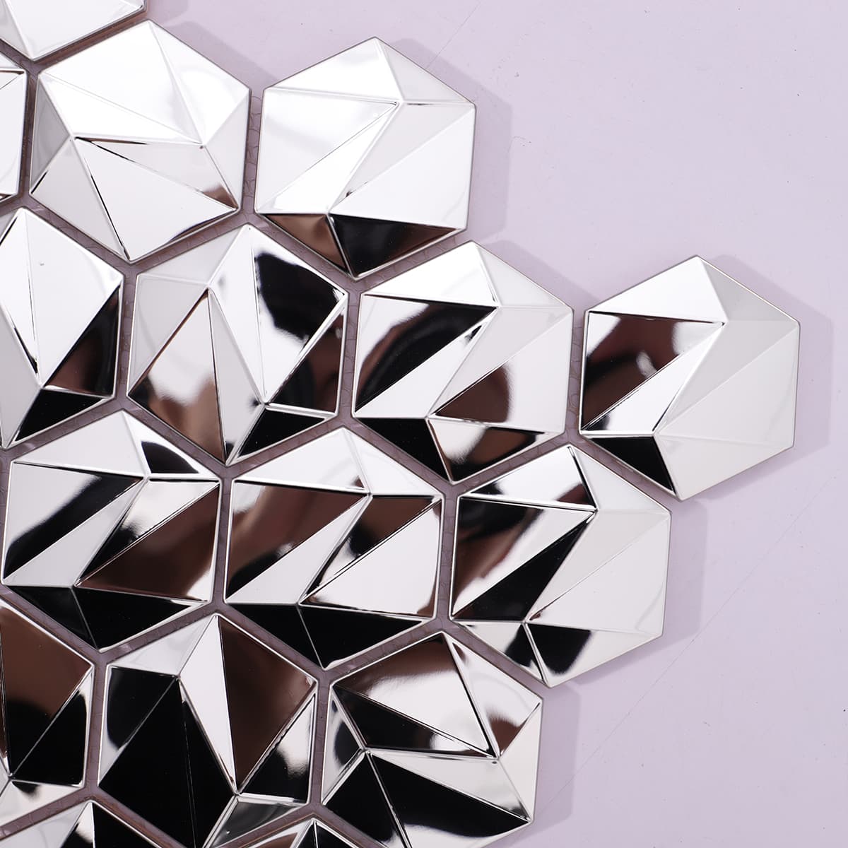 Shiny silver 3D hexagon mosaic tiles in close-up view