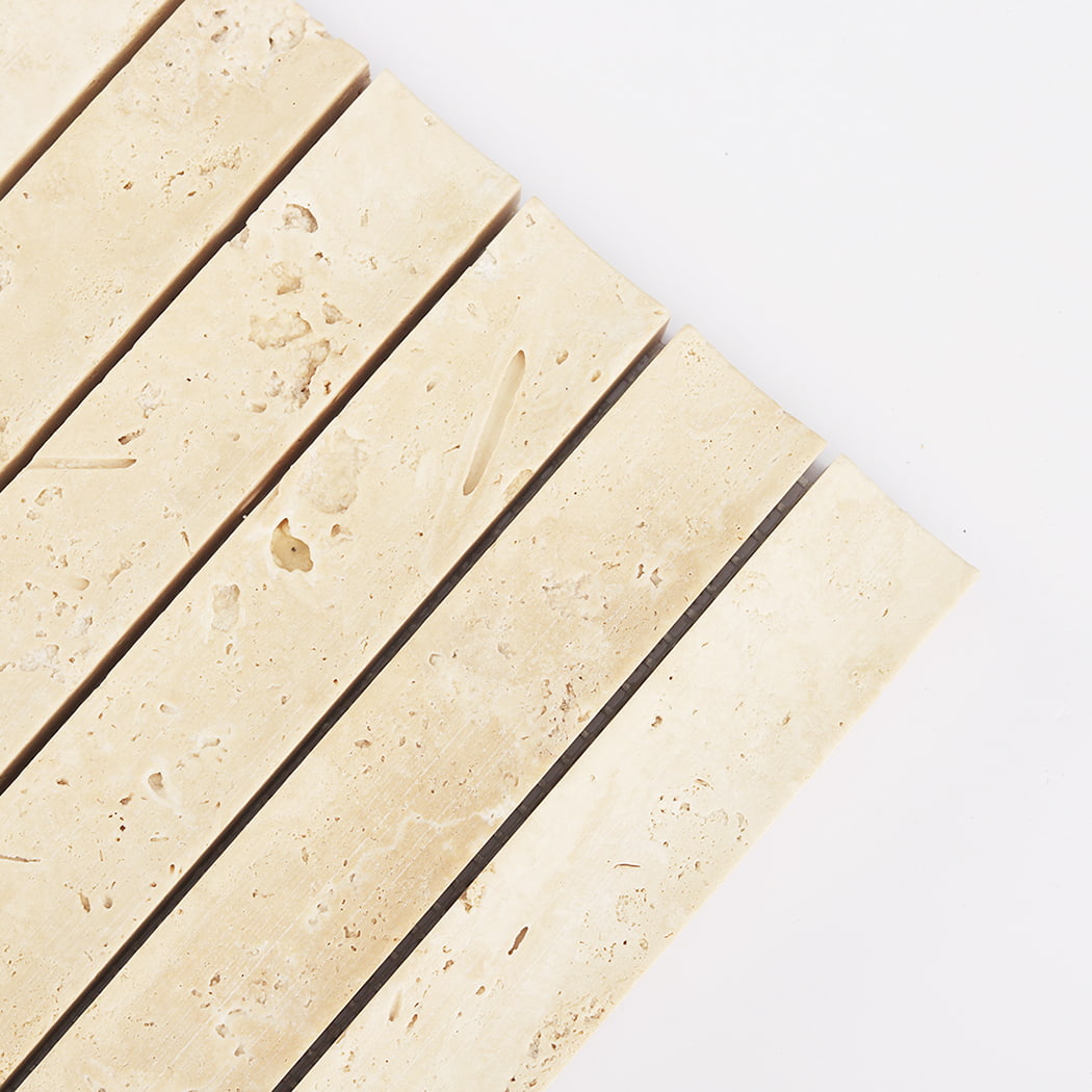 Detailed close-up showing the natural pores and fluted surface of Beige Travertine.