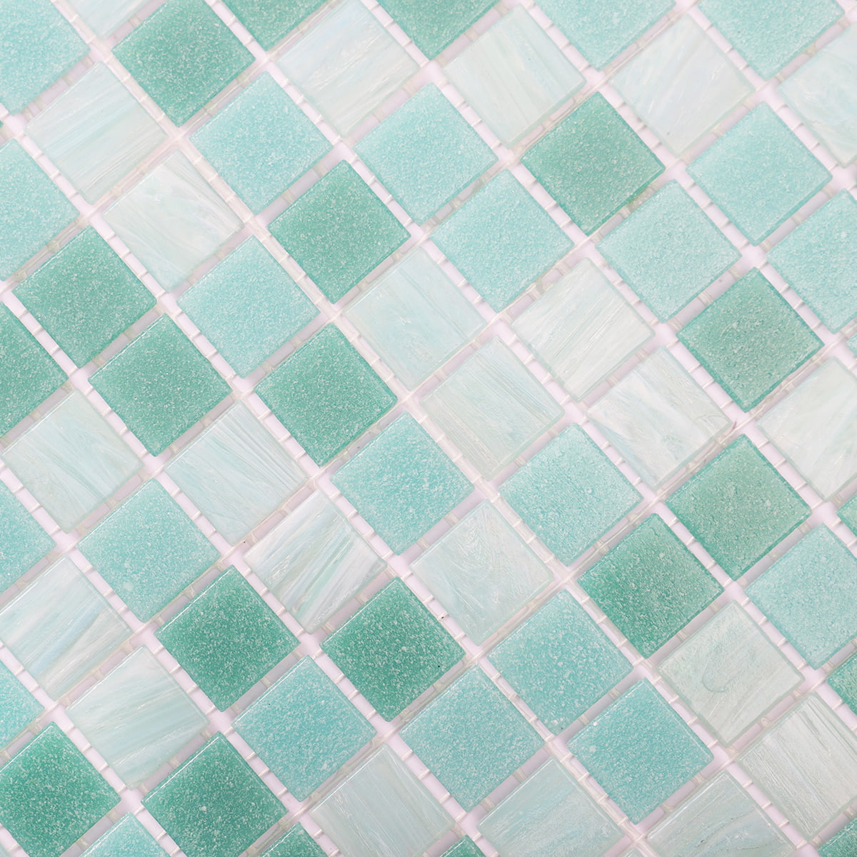 Close-up view of turquoise and green mosaic tiles in a diagonal layout