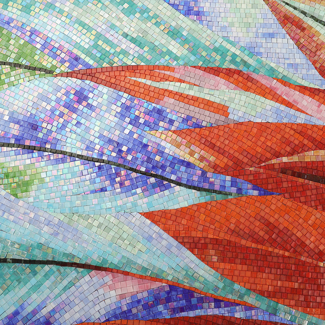 Colorful tropical leaf glass mosaic mural with red, blue, and green tones