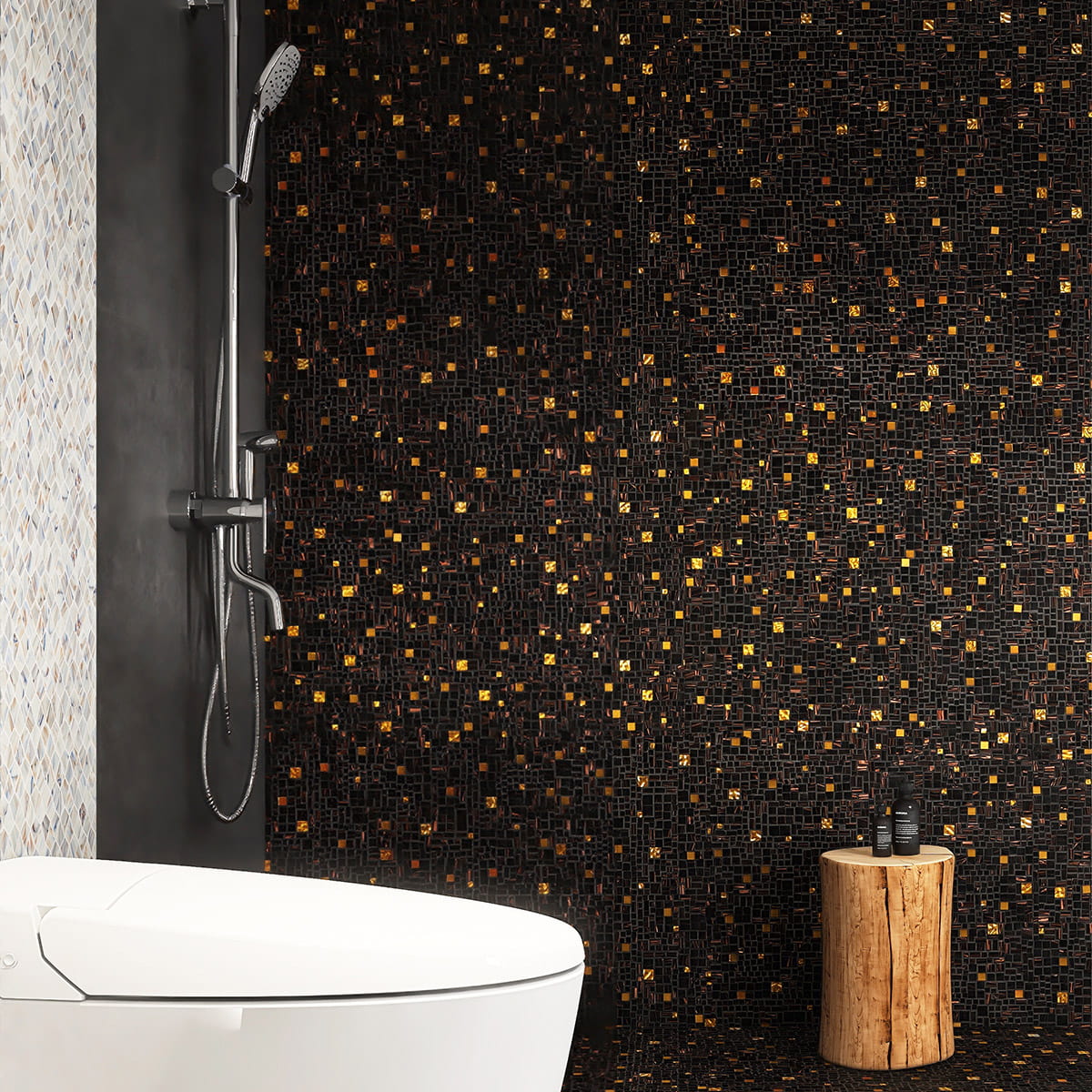 Contemporary bathroom featuring a black and gold mosaic tile wall with a sleek shower area
