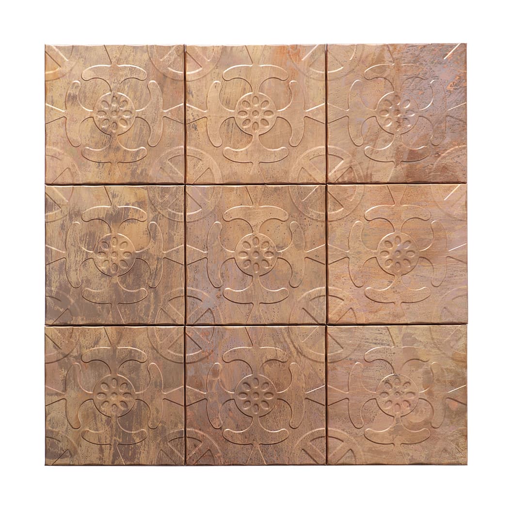 Top view of copper toned embossed flower mosaic tile sheet arranged in 3 by 3 squares.