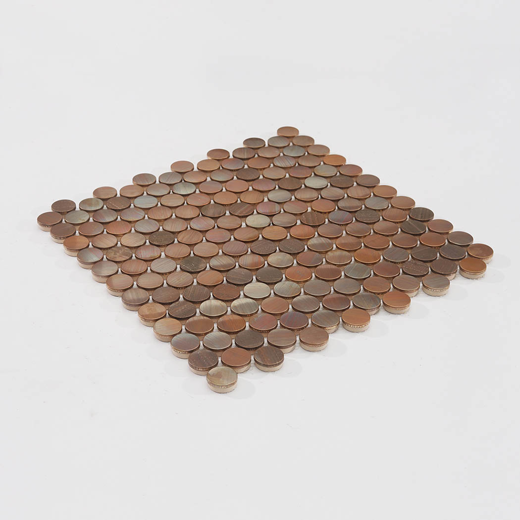 Angled view of copper penny round metal mosaic tile