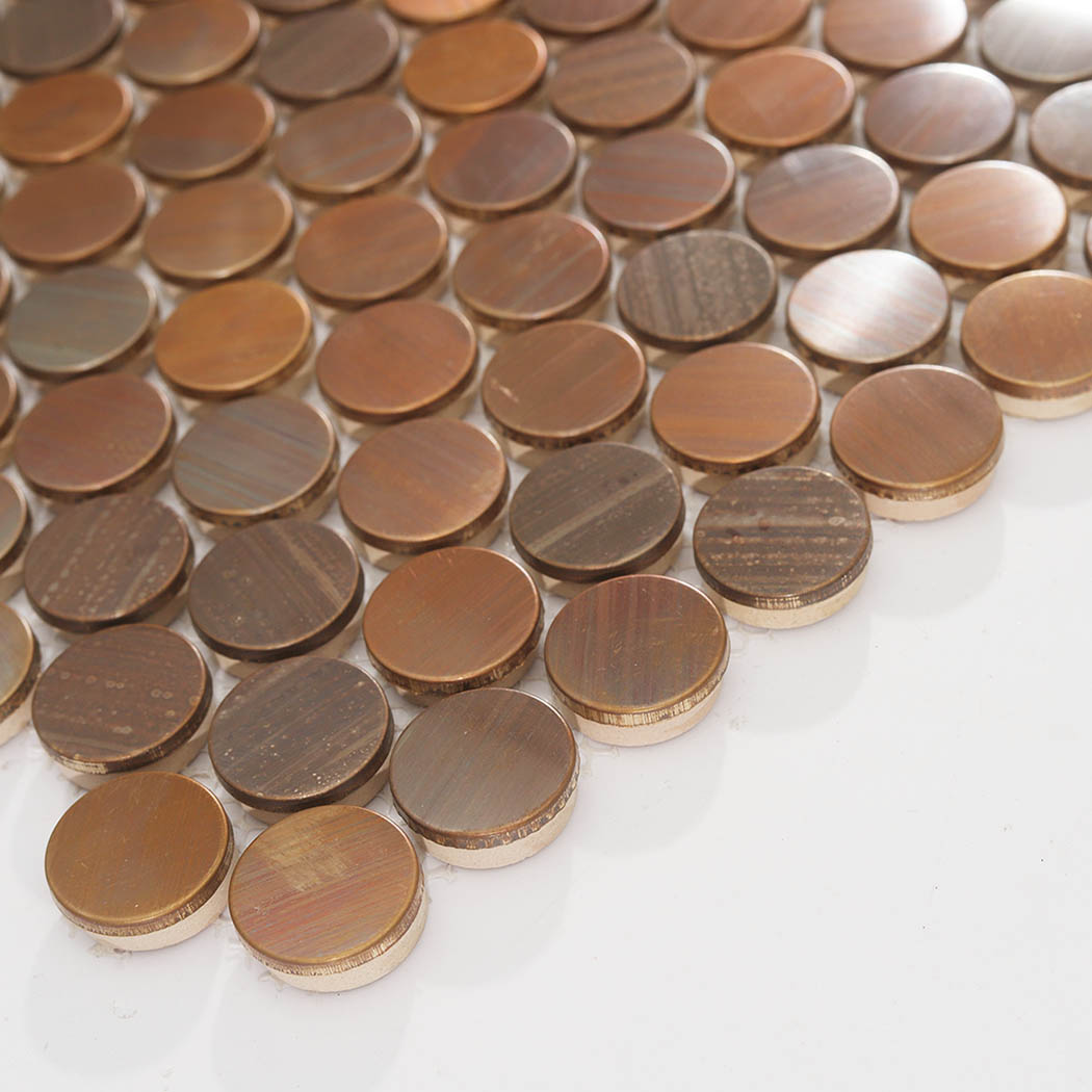 Edge detail of copper penny round metal mosaic tile