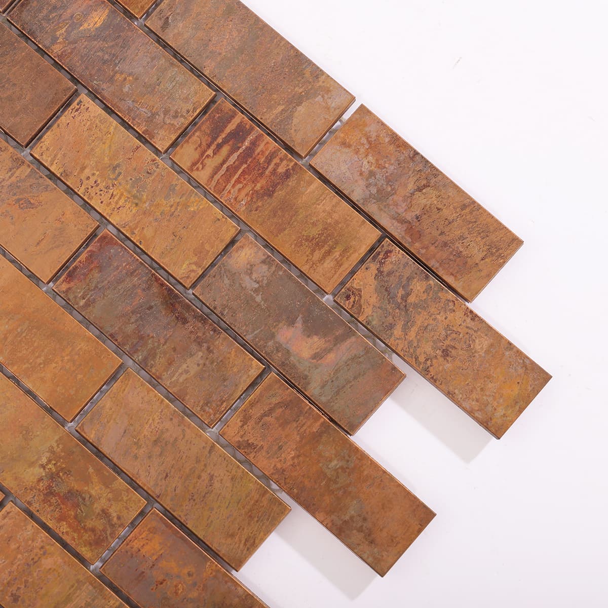 Diagonal close-up of rustic copper rectangle mosaic tile surface