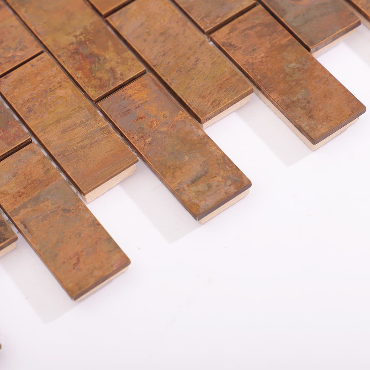 Side view showing thickness and edge finish of copper rectangle mosaic tile