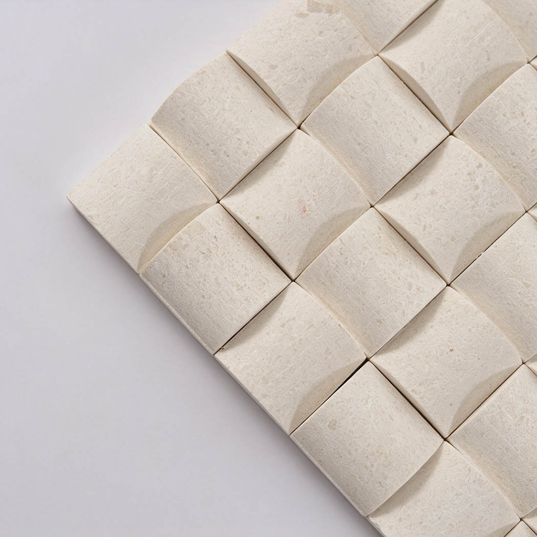 Close-up of cream 3D square mosaic tiles with softly curved surfaces