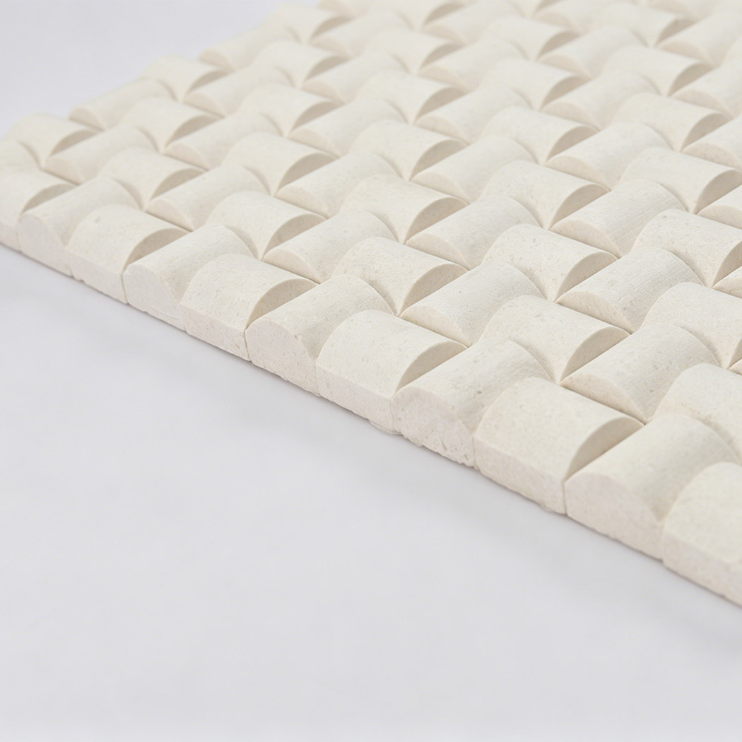 Side view of cream 3D square mosaic tiles showing raised curved relief
