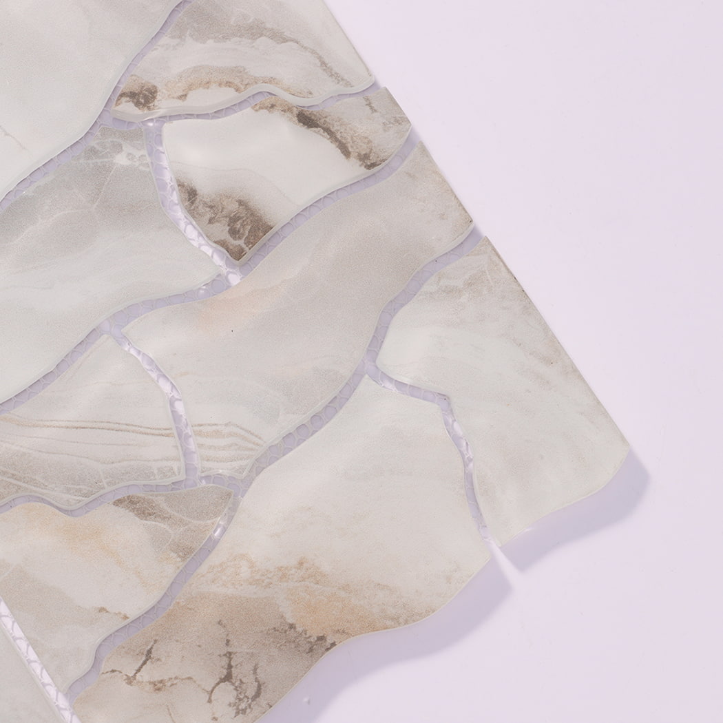 Close-up of cream beige cracked glass mosaic tiles with natural stone-look veining