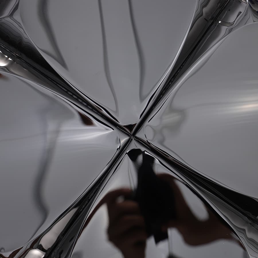 Macro view of intersecting center point where four 3D tiles meet.